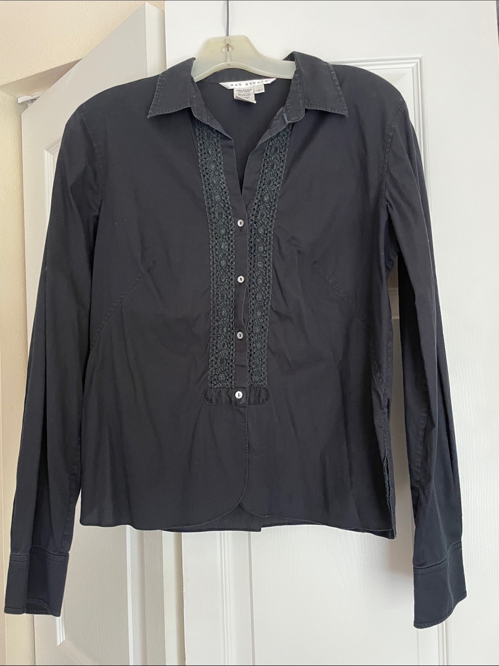 Long sleeved cotton/spandex black top. Machine washable.